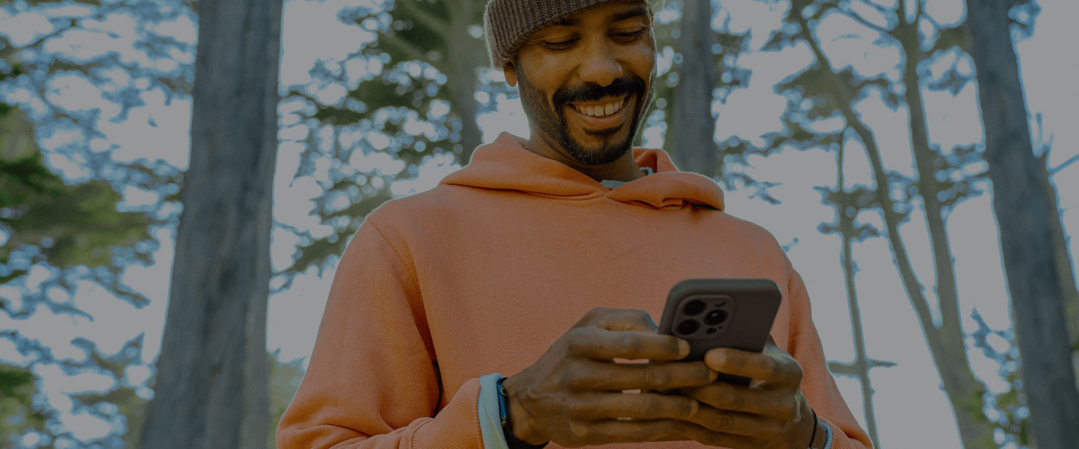 Man in Forest on Phone