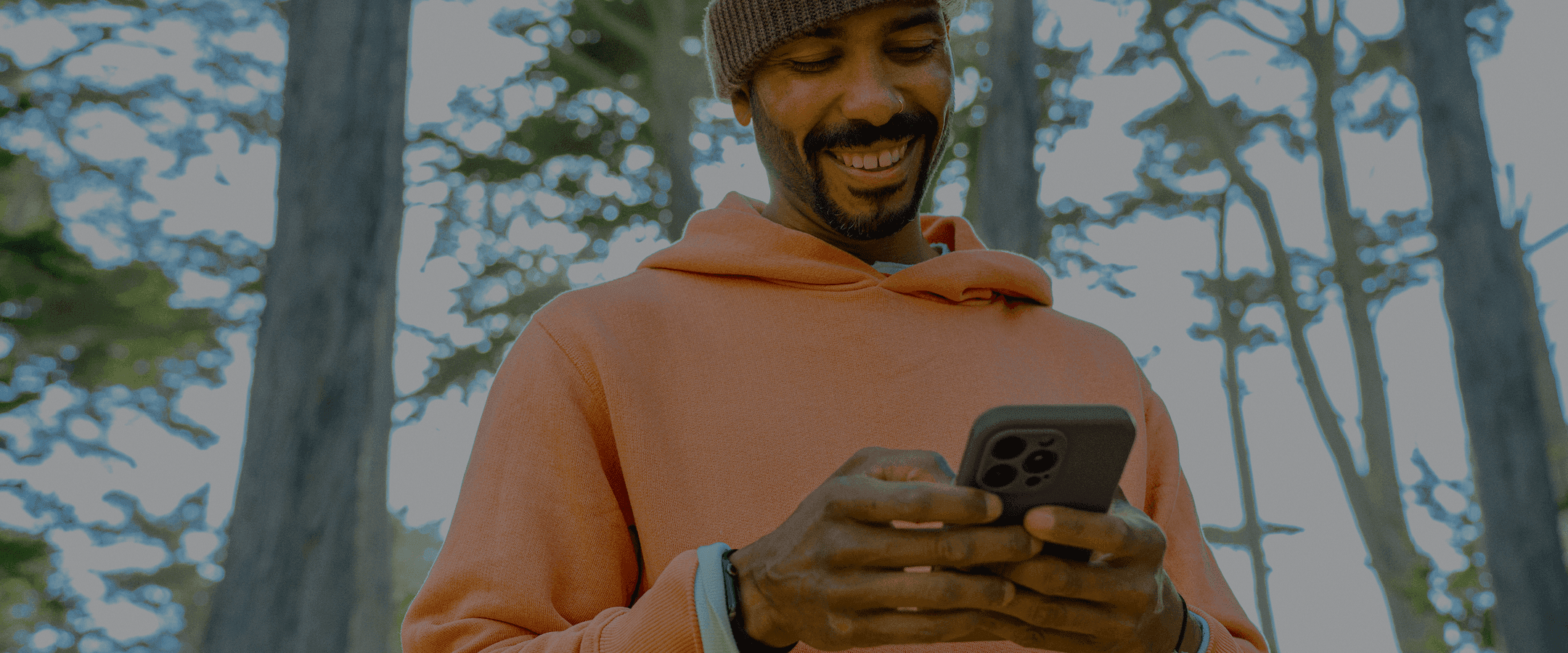 Man in Forest on Phone