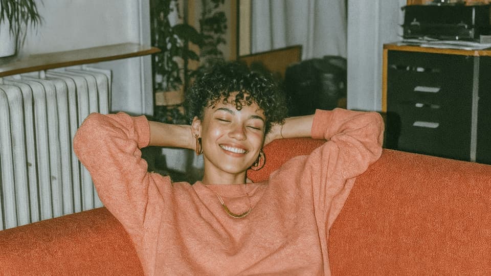 woman relaxing on a couch at home
