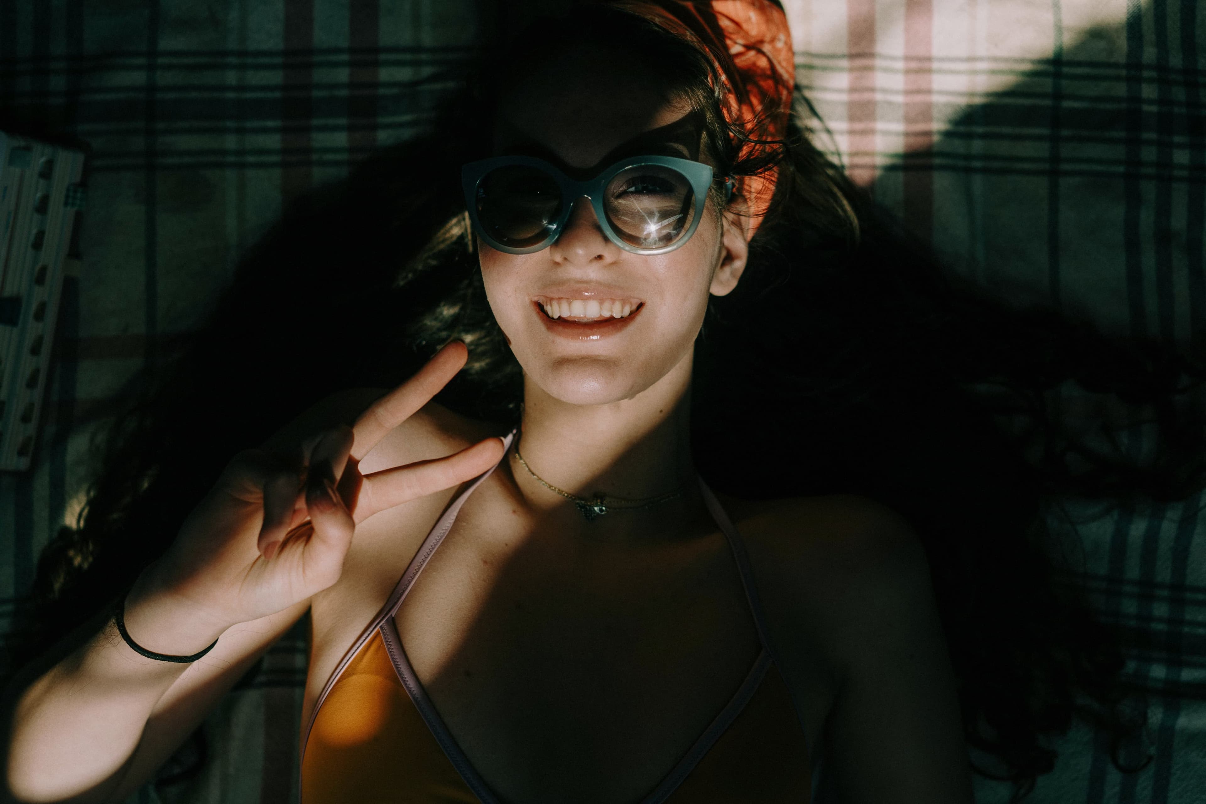 woman in hat and sunglasses