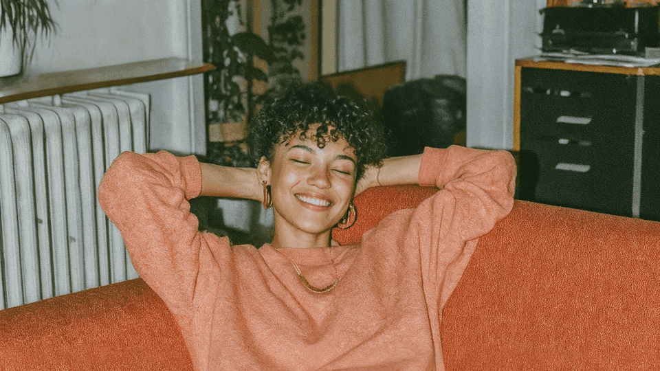 woman relaxing on a couch at home